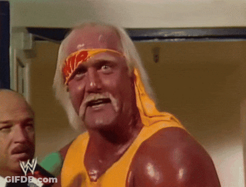 Hulk Hogan Is Wearing A Yellow Shirt And A Headband With A Wwe Logo On It GIF