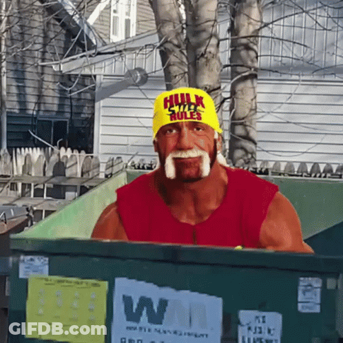 Hulk Hogan Sitting In Dumpster Wearing Yellow Hat Saying Hulk Rules GIF