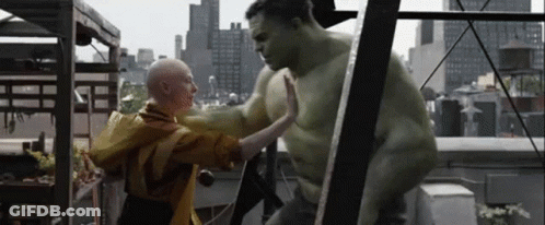 Hulk Is Giving A High Five To A Bald Woman On A Rooftop . GIF