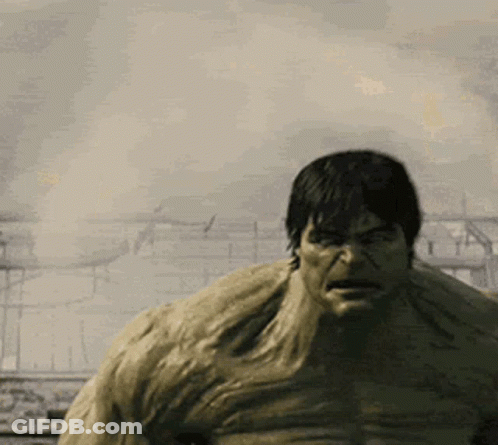 Hulk Standing In Front Of Burning Building GIF