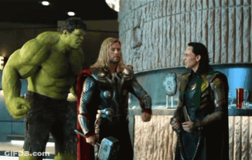Hulk Thor And Loki Standing Next To Each Other In A Room GIF