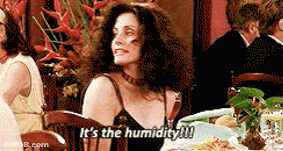 Humid Woman Holds Its Hair GIF