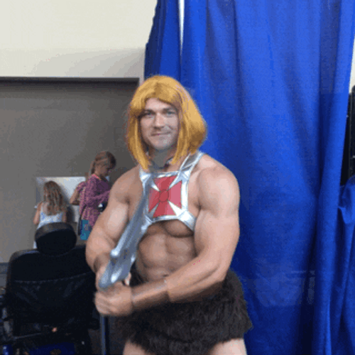 Hunk Cosplay He-Man Flexing Sword GIF