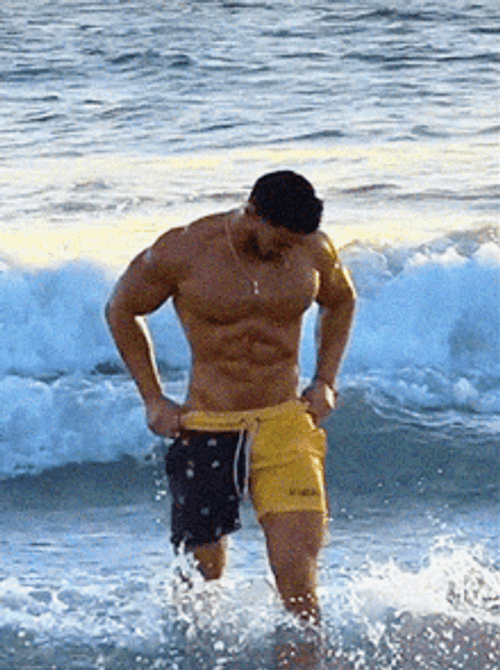 Hunk On The Beach GIF