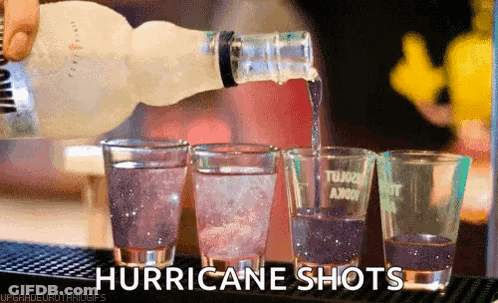 Hurricane Shots Are Being Poured Into Shot Glasses GIF