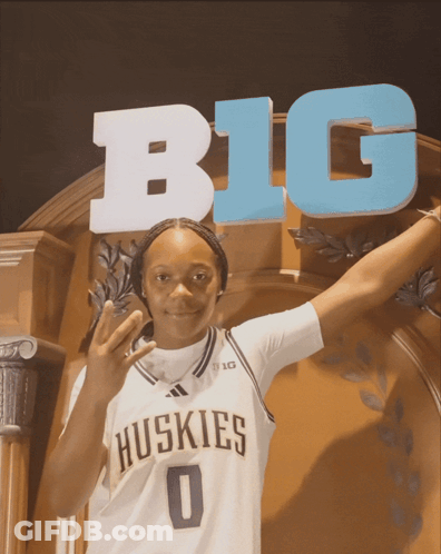 Huskies Player In Front Of Big Sign GIF