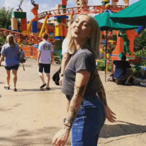 Hyped Girl At Theme Park GIF
