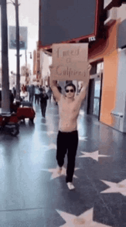 I Need A Girlfriend Signage Guy Cardboard GIF