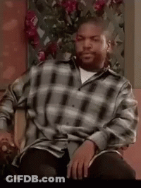 Ice Cube Sitting In Chair Wearing Plaid Shirt Smoking Cigarette GIF