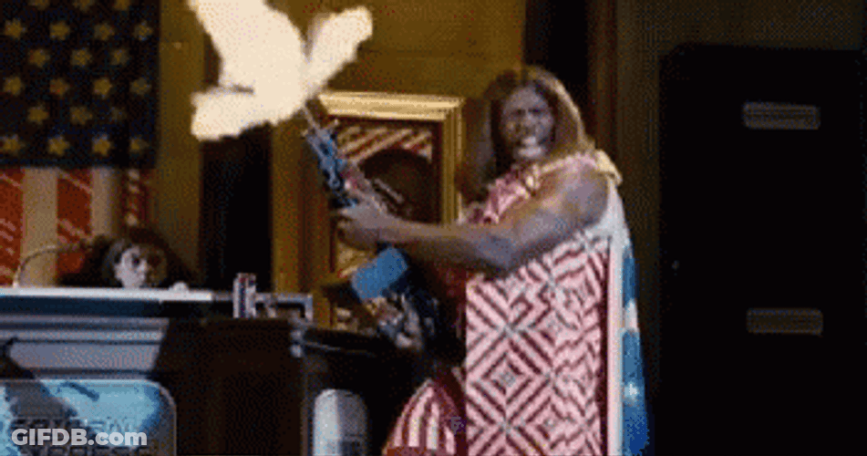 Idiocracy Terry Crews Holding Gun While Shooting GIF