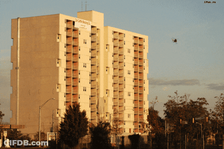 Implosion Of White Multi Story Building GIF