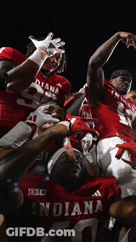 Indiana Football Players Celebrating Win GIF