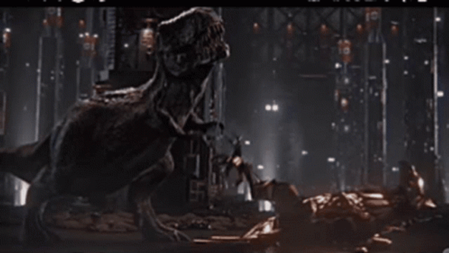 Indominus Rex Playing With Velociraptor GIF