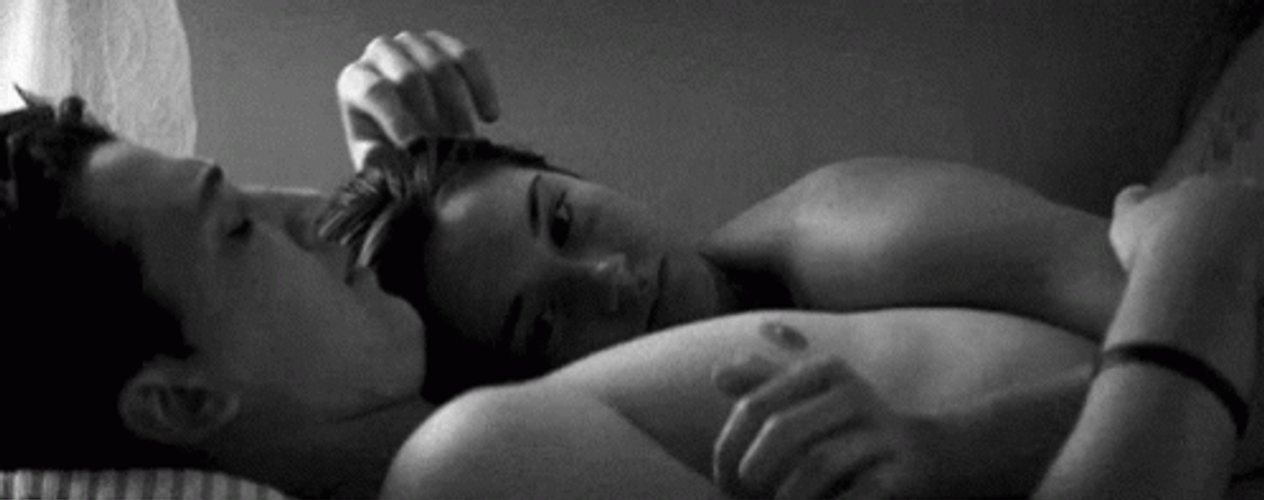 Intimate In Love Couple In Bed Caressing GIF