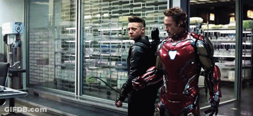 Iron Man And Hawkeye Standing In A Room GIF