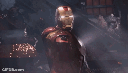 Iron Man Is Holding A Red Light Beam In His Hand . GIF