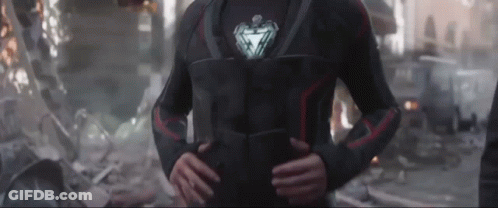 Iron Man Standing In Destroyed City Hands On Hips GIF