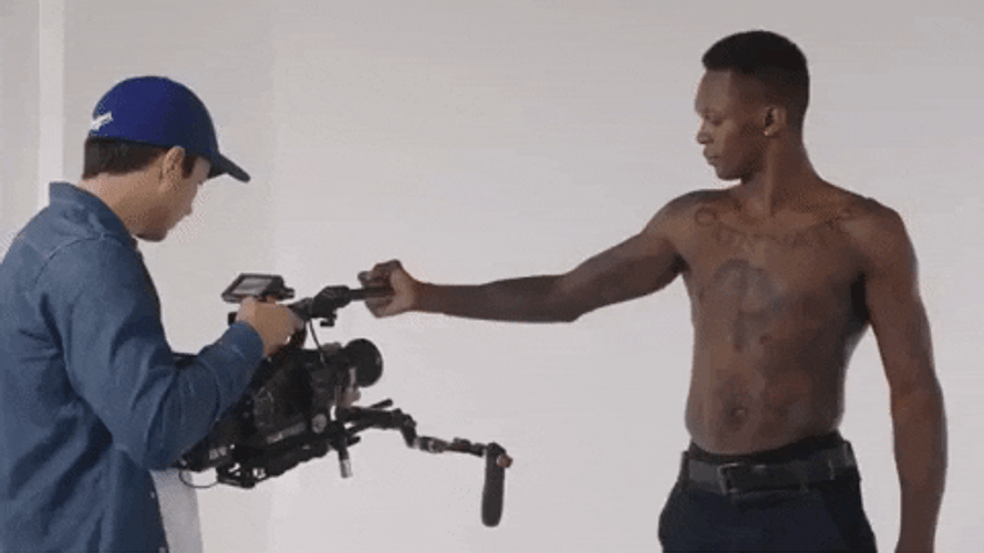 Israel Adesanya Flexing His Bicep GIF