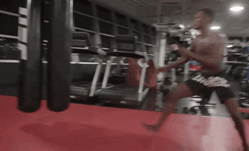 Israel Adesanya Kicking Punching Bag GIF