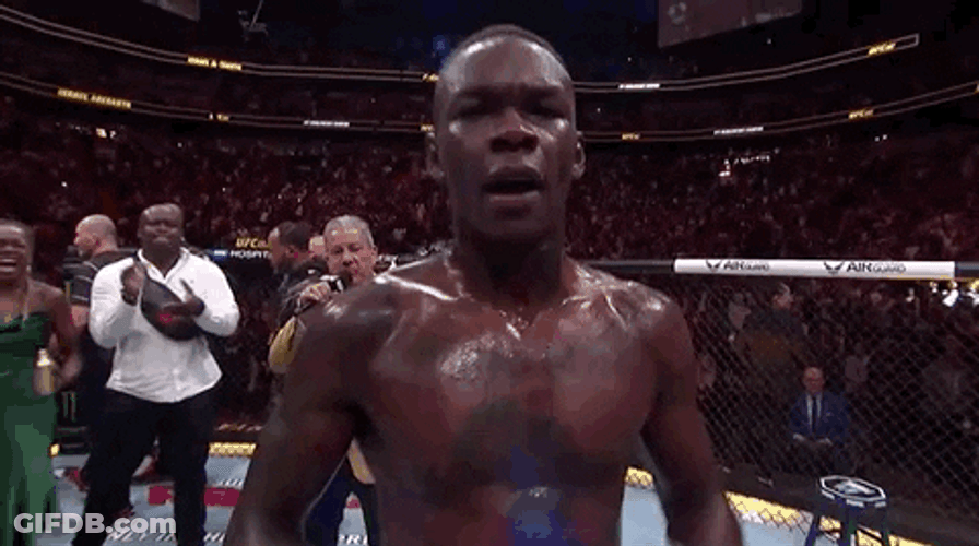Israel Adesanya Making Himself Smile GIF