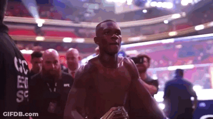 Israel Adesanya Showing Off His Belt GIF