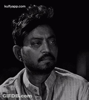 It Is A Black And White Photo Of A Man With A Beard . GIF