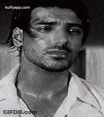 It Is A Black And White Photo Of A Man With A Beard . GIF