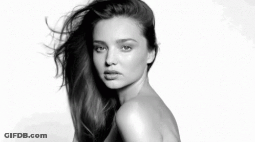 It Is A Black And White Photo Of A Naked Woman With Long Hair . GIF