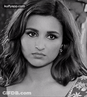 It Is A Black And White Photo Of A Woman Making A Funny Face . GIF