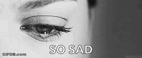 It Is A Black And White Photo Of A Woman 'S Eye With A Tear Coming Out Of It . GIF