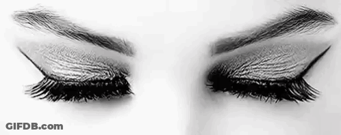 It Is A Black And White Photo Of A Woman 'S Eyes With Long Eyelashes . GIF