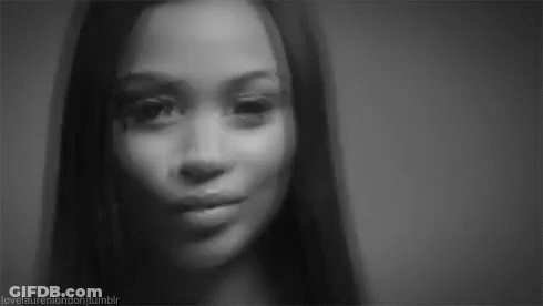 It Is A Black And White Photo Of A Woman 'S Face . GIF