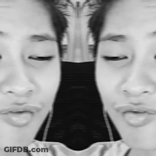 It Is A Black And White Photo Of A Woman 'S Face . GIF
