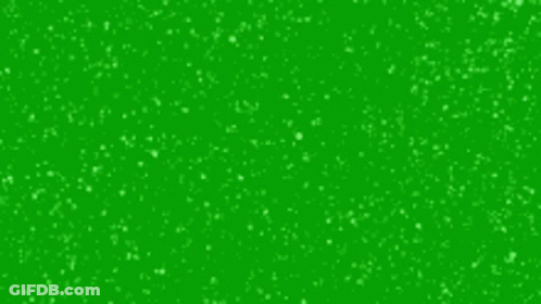 It Looks Like Snow Is Falling On A Green Background . GIF