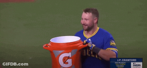 J.p. Crawford Holds A Gatorade Bucket On A Baseball Field GIF