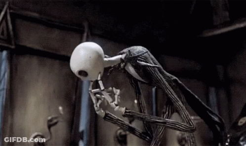 Jack Skellington From The Nightmare Before Christmas Is Standing In A Dark Room With His Mouth Open . GIF