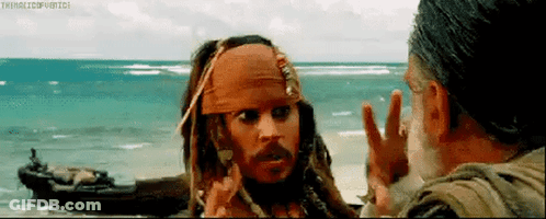 Jack Sparrow From Pirates Of The Caribbean Is Talking To A Man On A Beach . GIF