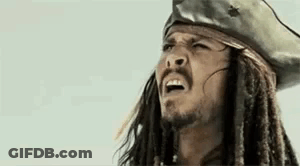 Jack Sparrow From Pirates Of The Caribbean Is Wearing A Pirate Hat And Dreadlocks . GIF