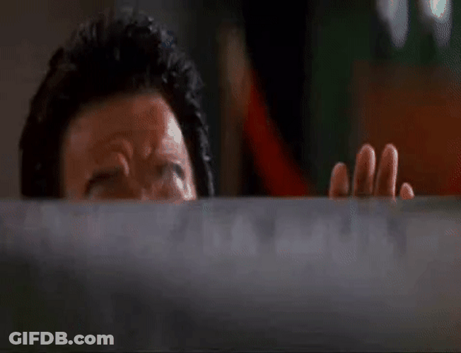 Jackie Chan Peeking Behind The Wall GIF