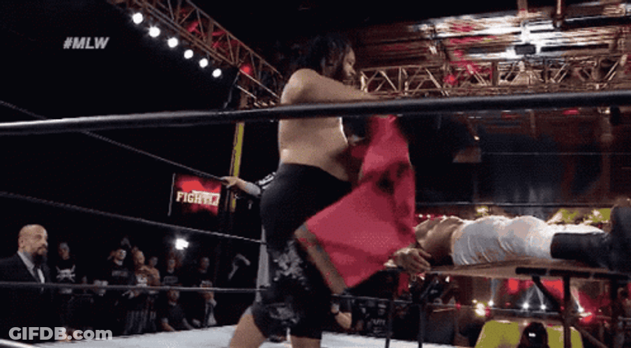Jacob Fatu Body Slamming Opponent On Table GIF