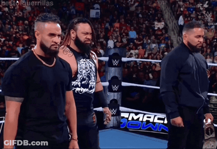 Jacob Fatu Standing In Middle Of Two Guys GIF