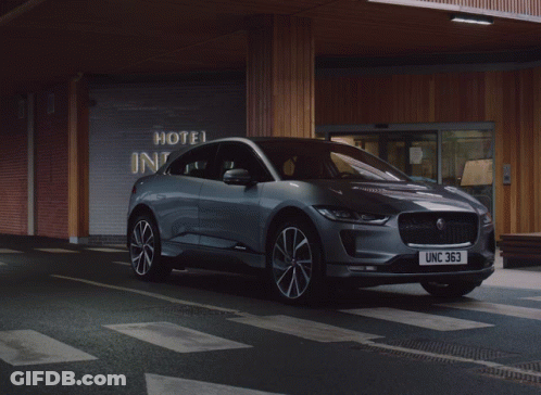 Jaguar Car Parked In Front Of Hotel GIF