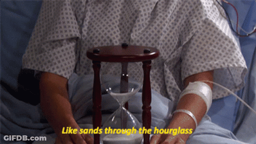 Janet Spears Holding An Hourglass GIF