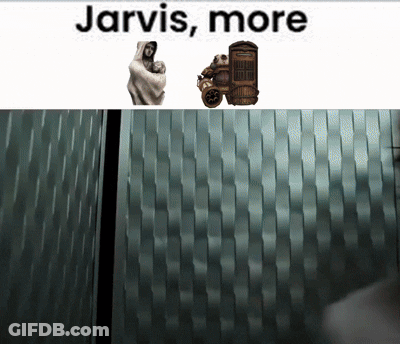 Jarvis More Is Written Above A Statue Of A Man Holding A Baby GIF