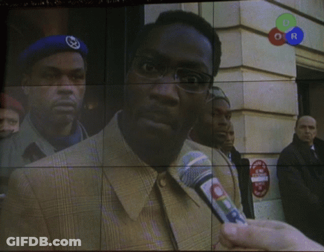 Jason Bourne Wombosi Talking On Microphone GIF