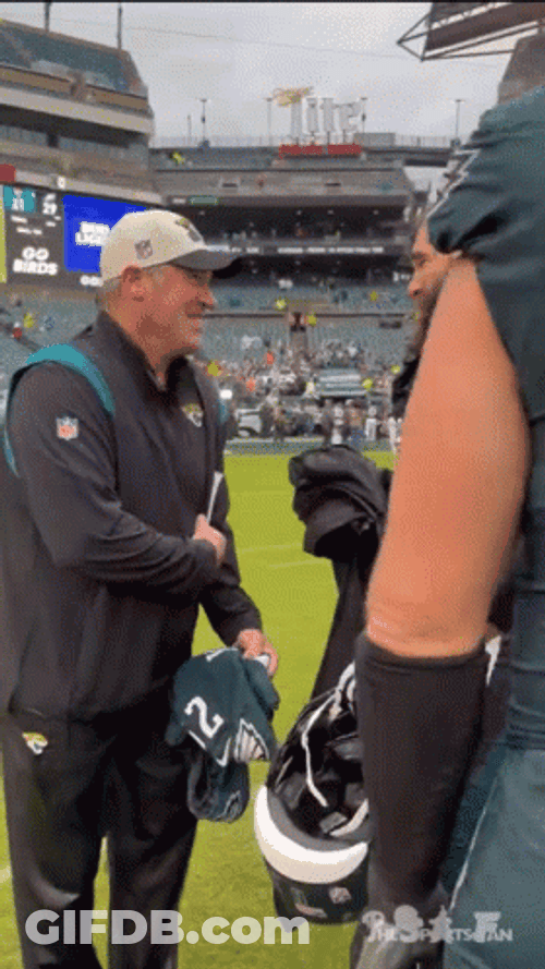 Jason Kelce Hugging A Man GIF