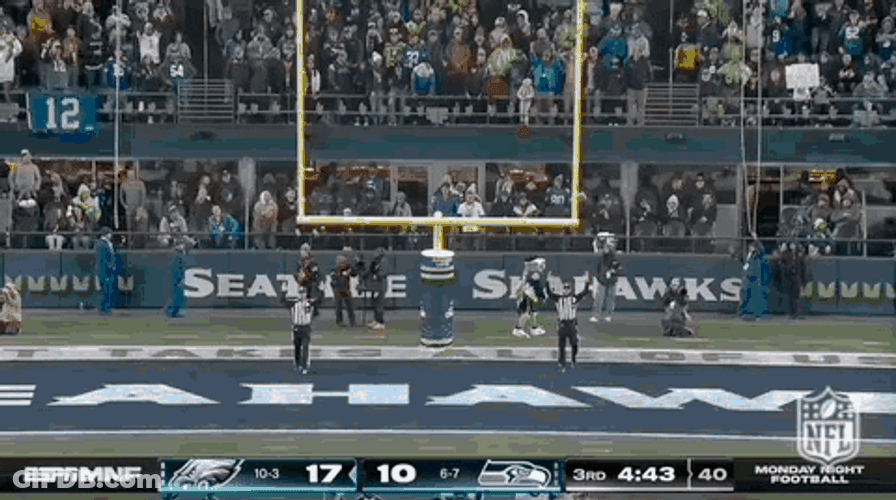 Jason Kelce Sitting While Talking To Teammate GIF