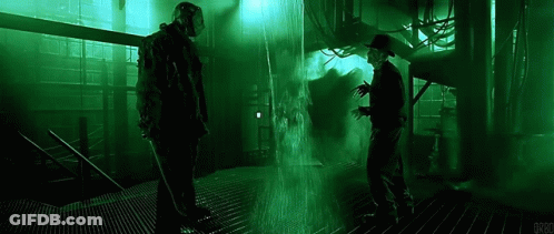 Jason Voorhees And Freddy Krueger Are Standing Next To Each Other In A Dark Room With A Green Light Behind Them . GIF