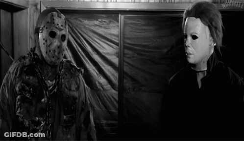 Jason Voorhees And Michael Myers Are In A Black And White Photo GIF