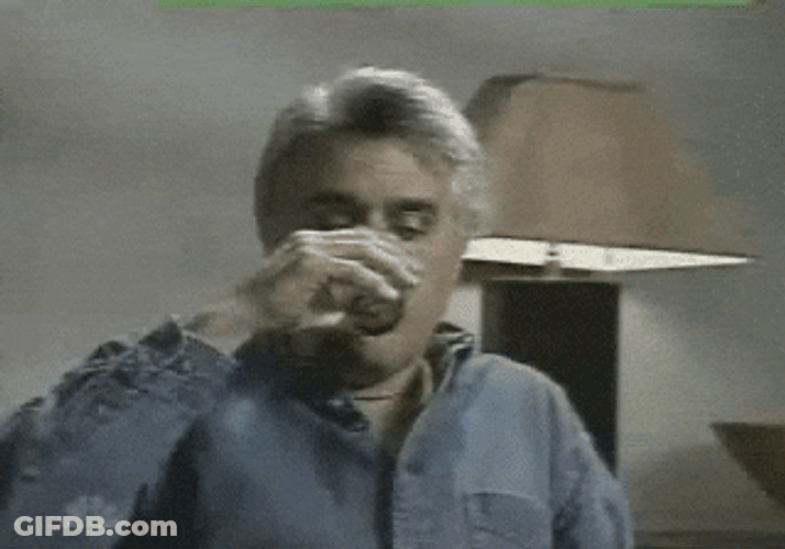 Jay Leno Surprised And Spit Out The Water GIF